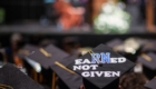At commencement, a graduate nurse signals pride in their accomplishment with the words EaRNed Not Given decorating their mortarboard.