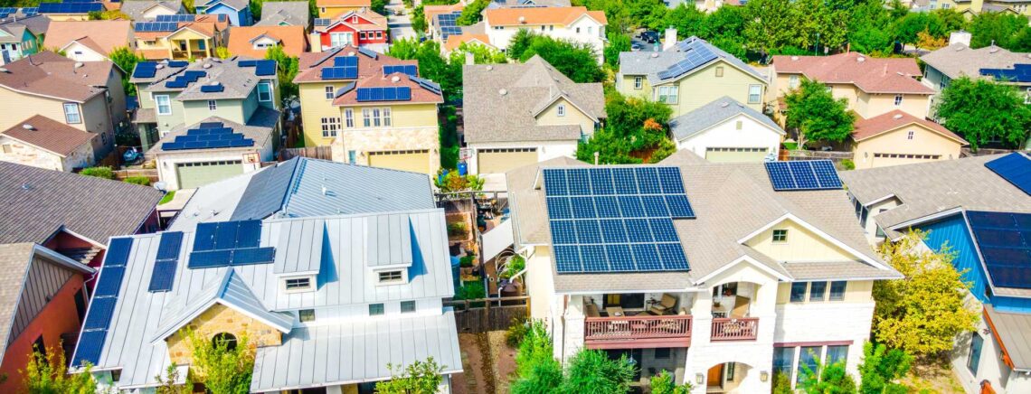 Aerial drone view of the Mueller District in Austin , Texas , USA - endless solar panels and a renewable , sustainable community of homes