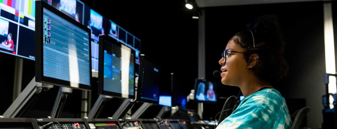 An ACC RTF student practices skills at a master control board during an RTF lab session.