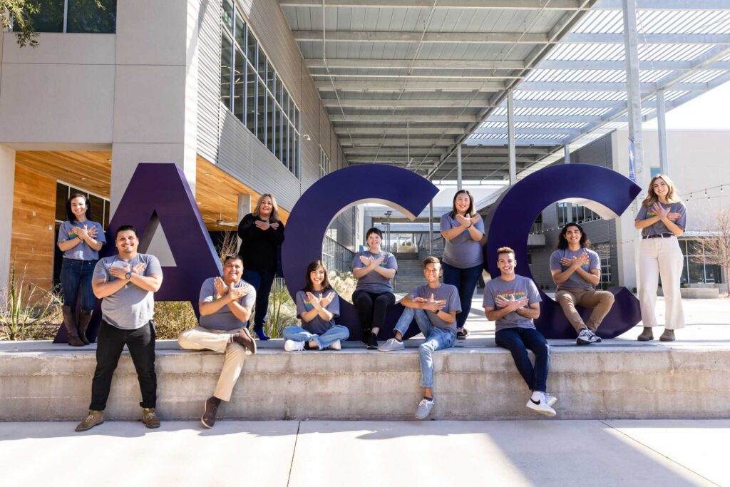The ACC Recruitment Team poses that the ACC letters at ACC Highland Campus. 