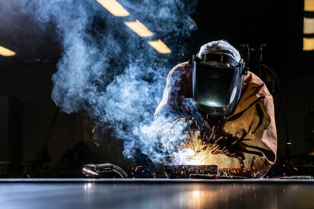AN ACC student welds during class instruction.