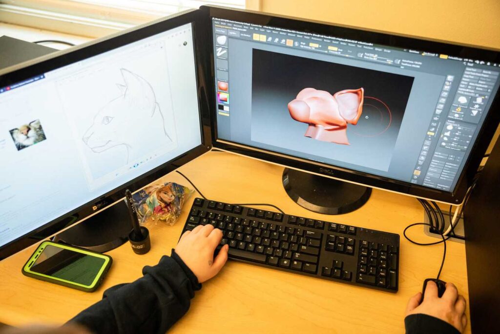 An ACC student works on a 3D computer model during class.