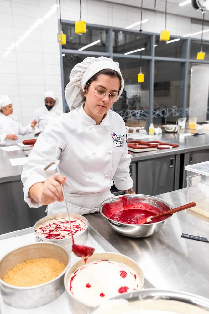 An ACC student works with cheesecakes during culinary classes.
