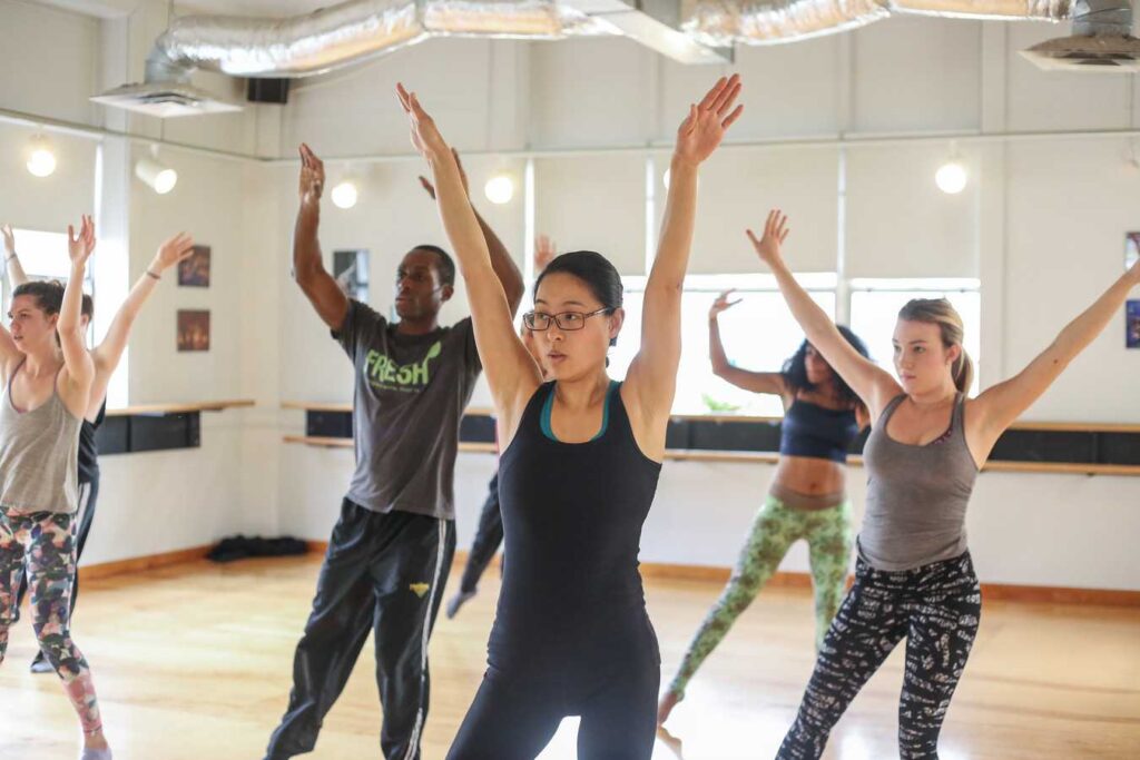 ACC Students practice a choreographed dance routine inside of ACC's dance studios.
