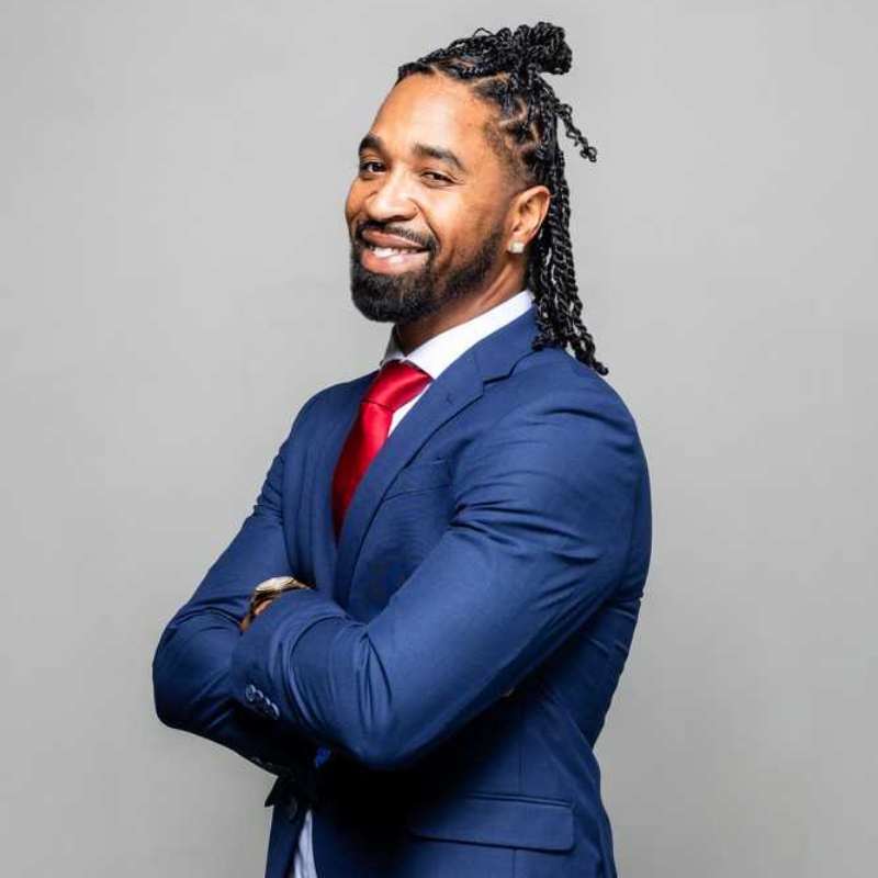 ACC Business student poses in a sharp looking suit.